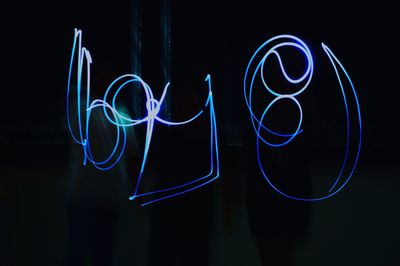 Illuminated light painting in darkroom