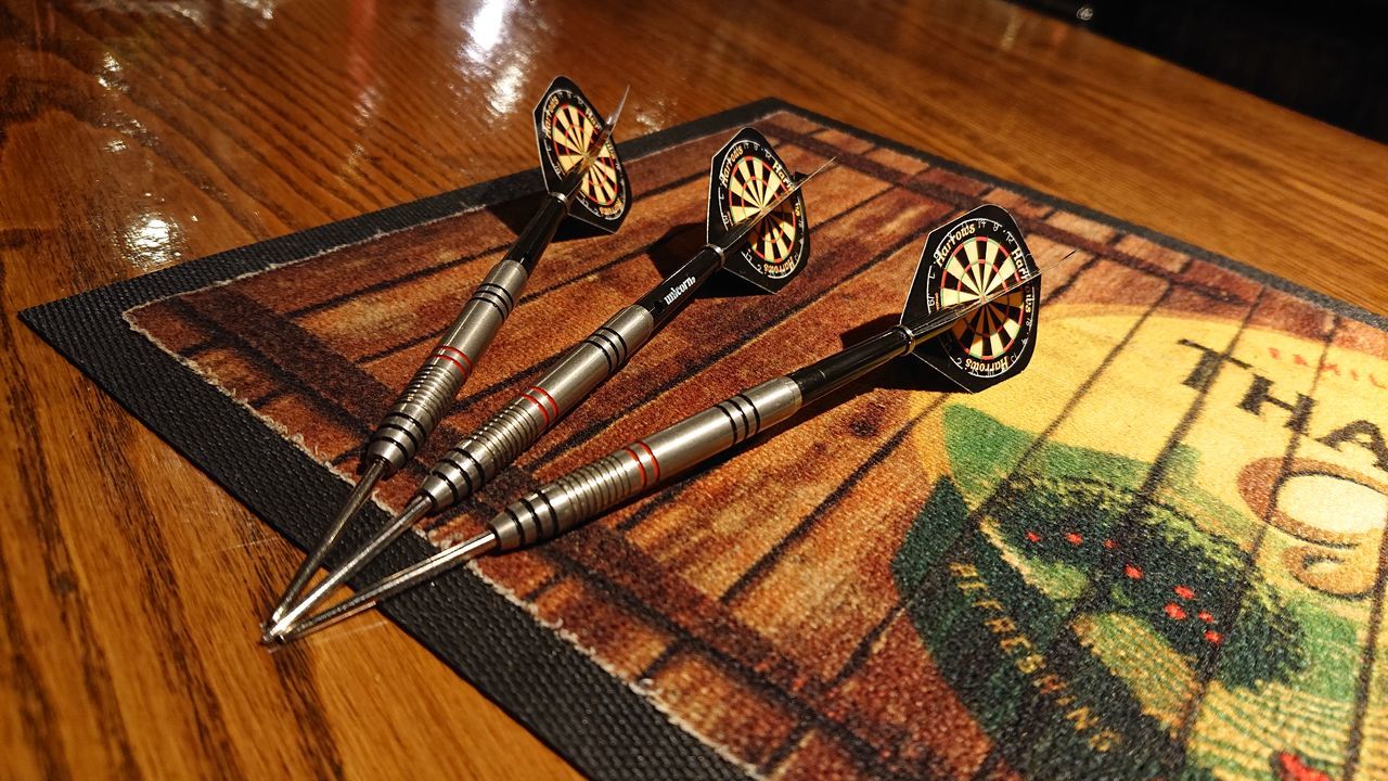 HIGH ANGLE VIEW OF BICYCLES ON TABLE AT HOME