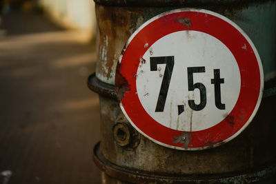 Close-up of warning sign on metal