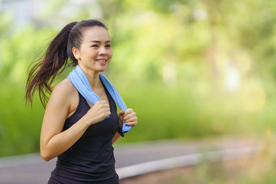 Portrait of young woman using mobile phone