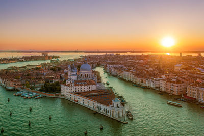 Panoramic view of buildings against sky during sunset