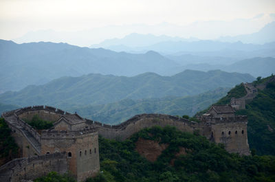 High angle view of great wall of china against mountains