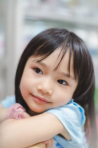 Close-up portrait of smiling girl