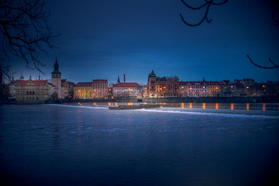 Illuminated buildings at waterfront