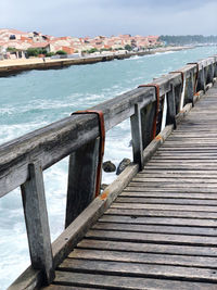 Pier over sea against sky