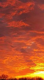 Scenic view of landscape against sky at sunset