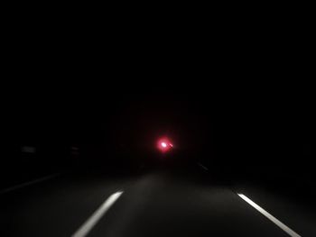 Car on road at night