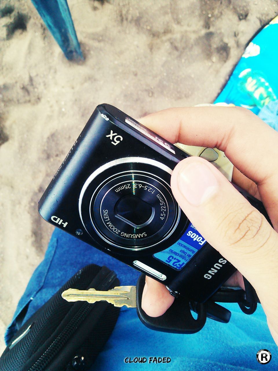 person, wristwatch, close-up, blue, outdoors, focus on foreground, human finger, modern