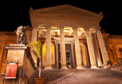 Low angle view of statue at night