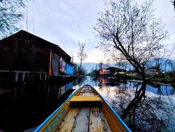 View of canal along bare trees