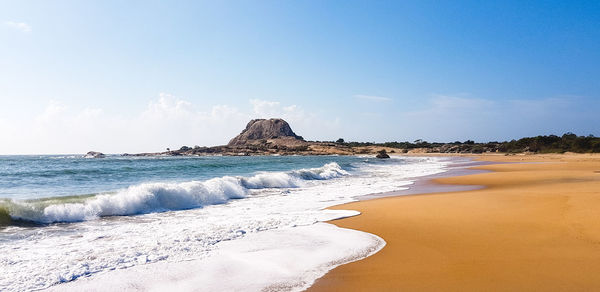 Scenic view of beach against sky