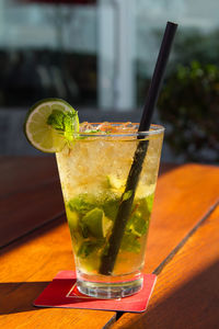 Close-up of fresh mojito served on table at cafe