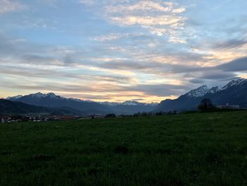 Scenic view of landscape against dramatic sky