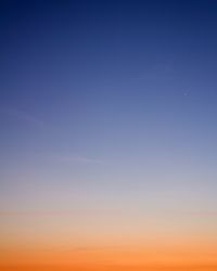 Low angle view of clear sky at sunset