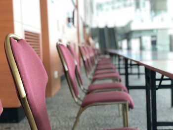 Empty chairs and tables in restaurant