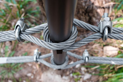 Close-up of rope tied on railing