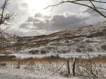 Scenic view of landscape against sky during winter