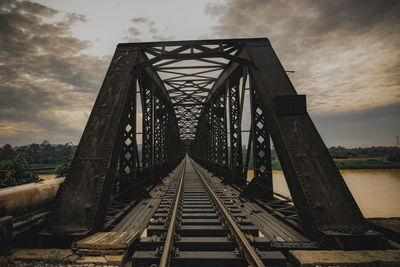 Low angle view of railway bridge against sky