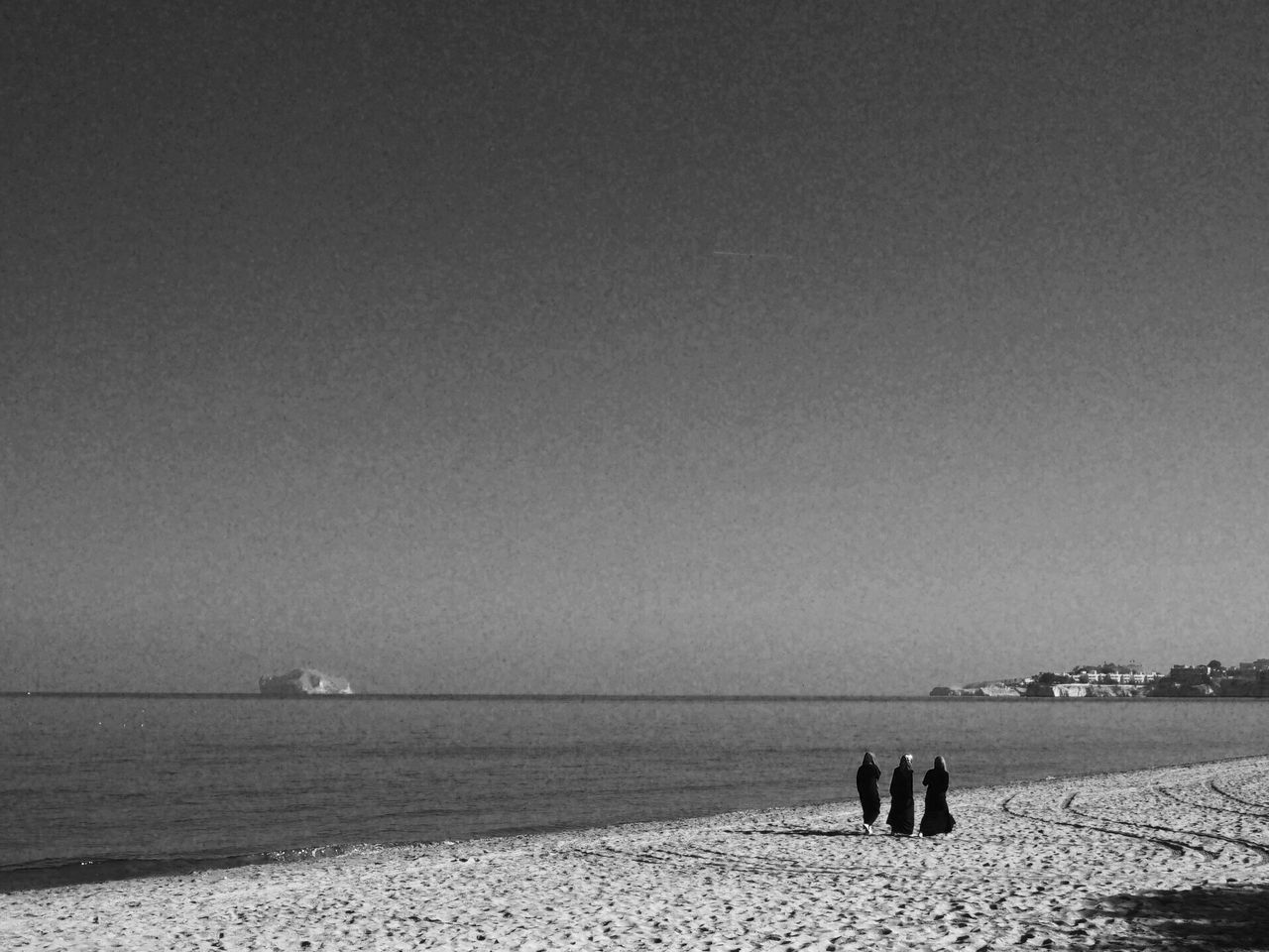 PEOPLE ON BEACH AGAINST SKY