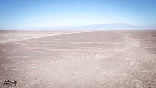 View of desert against blue sky