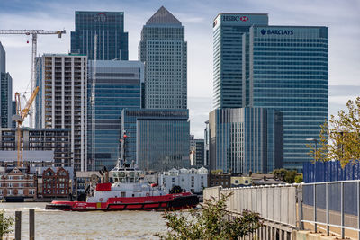 Modern buildings in city against sky