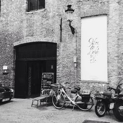 Bicycle parked in front of building