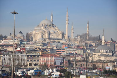 Panoramic view of buildings in city against sky