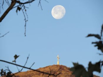 Low angle view of moon against clear sky