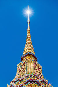 Low angle view of temple against clear blue sky