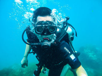 High angle view of man swimming in sea