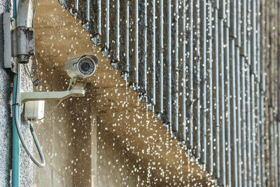 Full frame shot of wet glass against wall