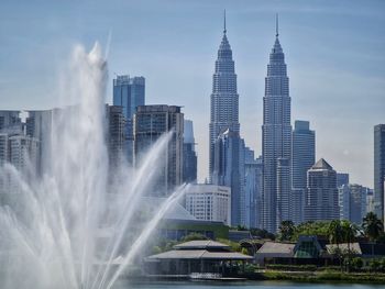 Modern buildings in city against sky