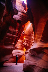 Person photographing in antelope canyon