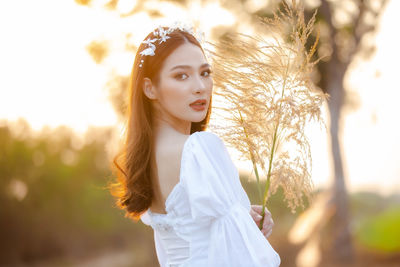 Portrait of beautiful young woman outdoors