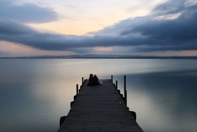 Pier over sea against sky