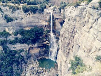 Scenic view of waterfall on landscape