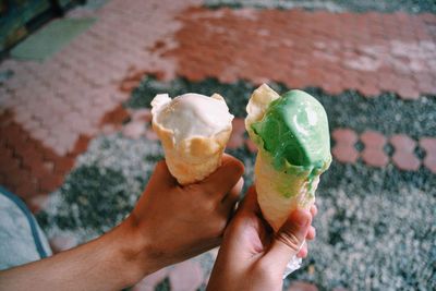 Close-up of hand holding ice cream