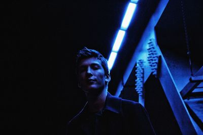 Low angle view of illuminated lighting equipment