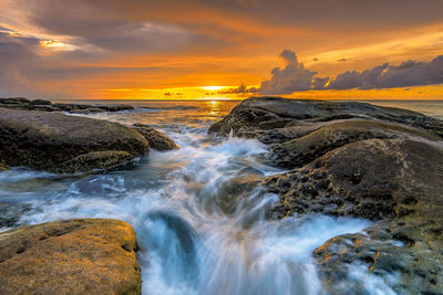 Scenic view of sea against sky during sunset