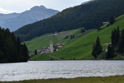 Scenic view of lake and mountains against sky