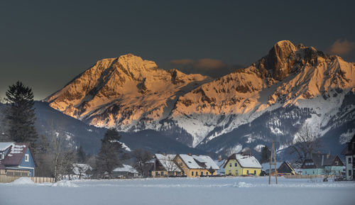 Scenic view of snowcapped mountains against clear sky