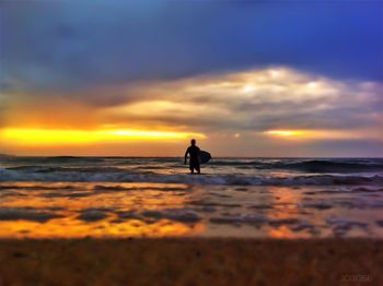 Scenic view of sea at sunset