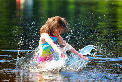 Boy playing in swimming pool