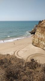 Scenic view of beach against clear sky