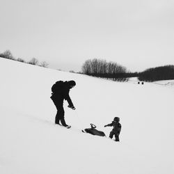 Person skiing on snow covered field