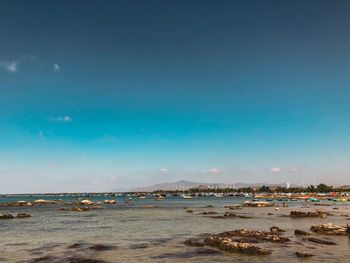 Scenic view of sea against clear blue sky