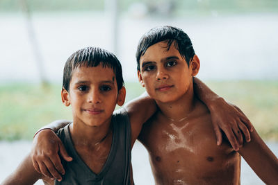 Brothers wet by rain