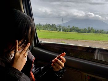 Side view of woman. view of mt. mayon volcano, albay, philippines