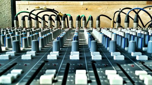 Close-up of sound mixer at studio