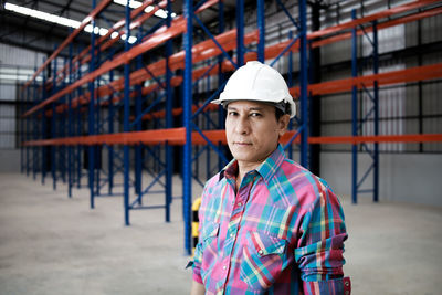 Portrait of man working at construction site